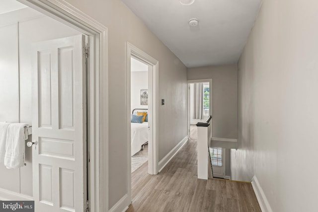 327 W Fourth St, Media, PA 19063 - hall with wood finished floors, baseboards, and an upstairs landing