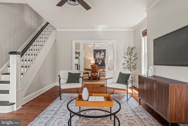 327 W Fourth St, Media, PA 19063 - living area with stairs, wood finished floors, ornamental molding, ceiling fan, and a chandelier