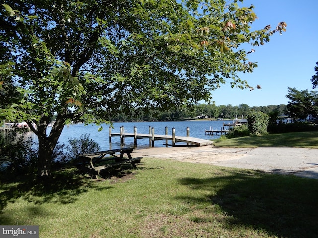 7638 Laurel Dr, Pasadena, MD 21122 - dock featuring a lawn and a water view