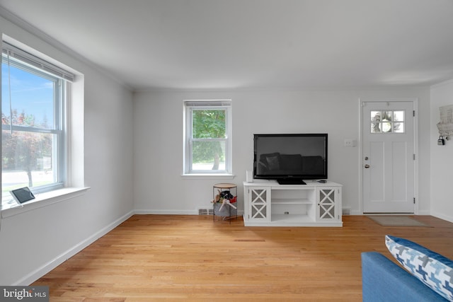 45 W Woodland Ave, Springfield, PA 19064 - living area with light wood finished floors, baseboards, and ornamental molding