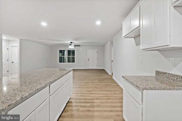 183 Silage Ln, Berkeley Springs, WV 25411 - kitchen featuring ceiling fan, light wood-type flooring, white cabinetry, recessed lighting, and light stone countertops