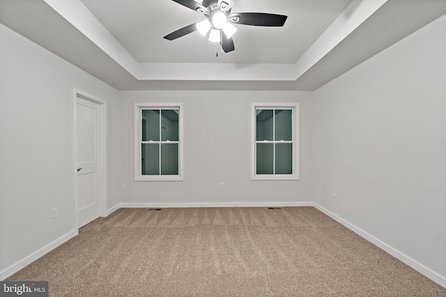 183 Silage Ln, Berkeley Springs, WV 25411 - empty room with a raised ceiling, carpet floors, a ceiling fan, and baseboards