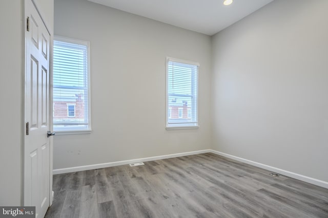 1229 N Potomac St, Baltimore, MD 21213 - spare room featuring healthy amount of natural light, wood finished floors, baseboards, and recessed lighting