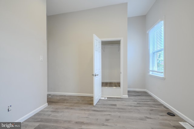 1229 N Potomac St, Baltimore, MD 21213 - unfurnished bedroom with wood finished floors and baseboards