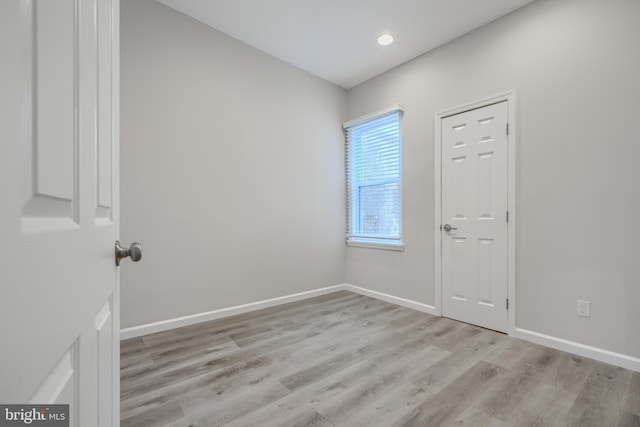 1229 N Potomac St, Baltimore, MD 21213 - unfurnished room with wood finished floors, baseboards, and recessed lighting
