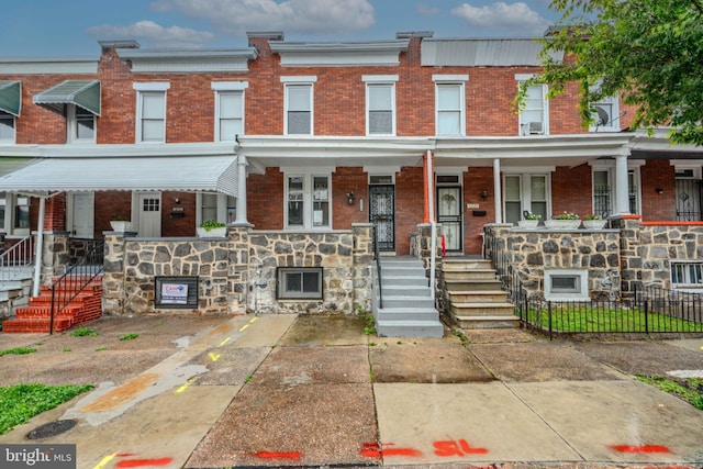 1229 N Potomac St, Baltimore, MD 21213 - multi unit property featuring brick siding, covered porch, and stone siding