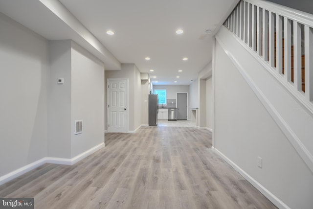 1229 N Potomac St, Baltimore, MD 21213 - hallway featuring light wood-style flooring, recessed lighting, and baseboards