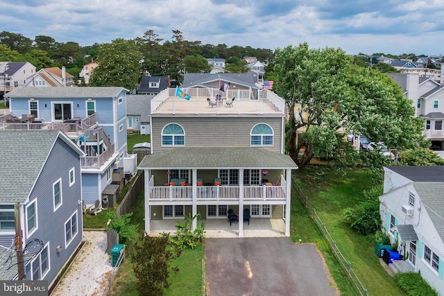 107 Swedes St, Dewey Beach, DE 19971 - rear view of house featuring a balcony and a residential view