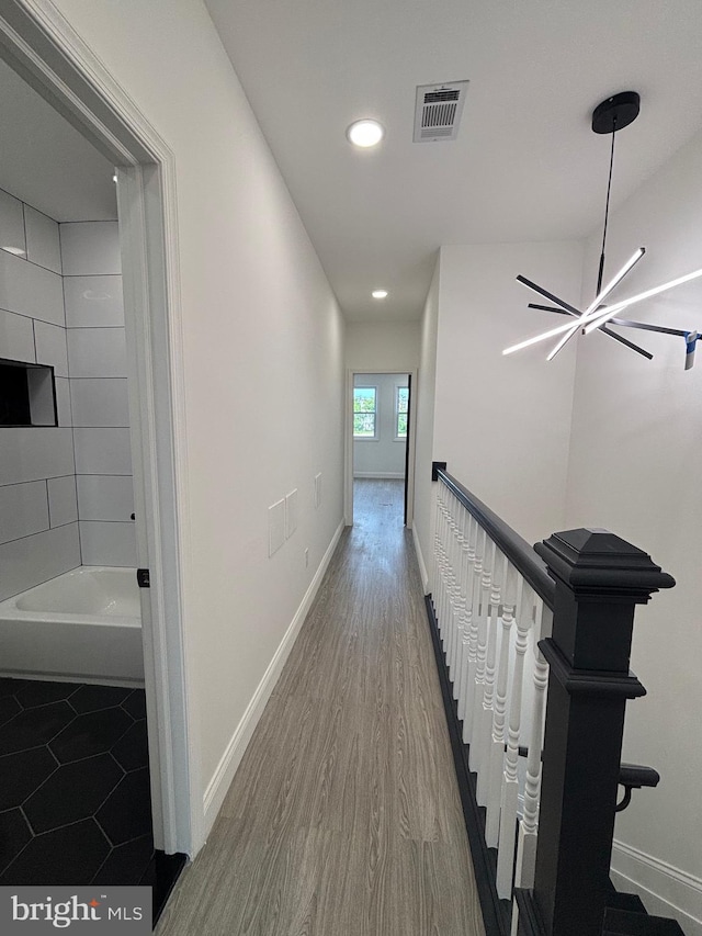 1748 N Chester St, Baltimore, MD 21213 - hallway with recessed lighting, baseboards, wood finished floors, and a chandelier