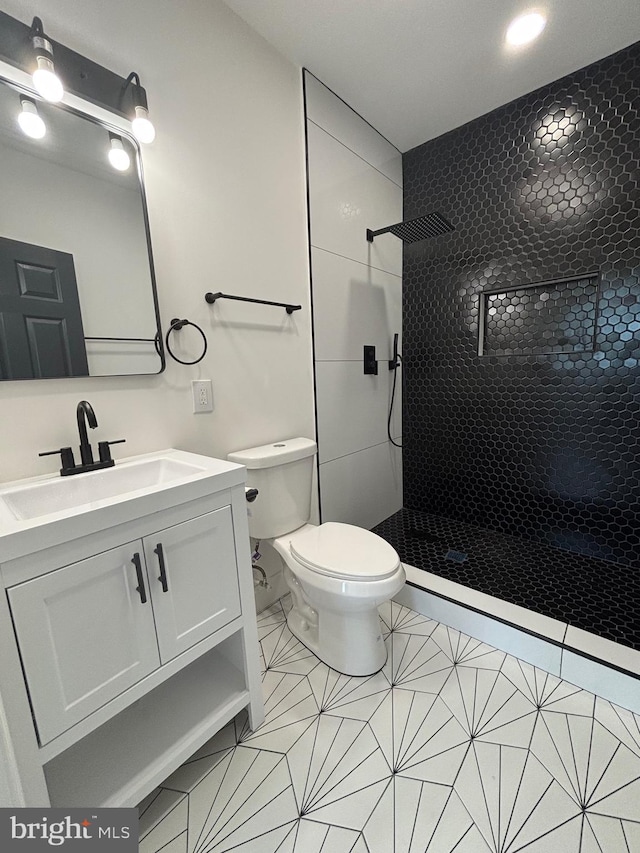 1748 N Chester St, Baltimore, MD 21213 - bathroom featuring a stall shower, toilet, and vanity