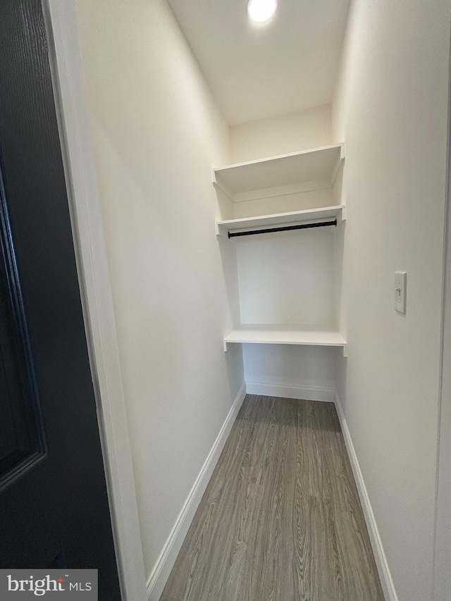 1748 N Chester St, Baltimore, MD 21213 - walk in closet featuring wood finished floors