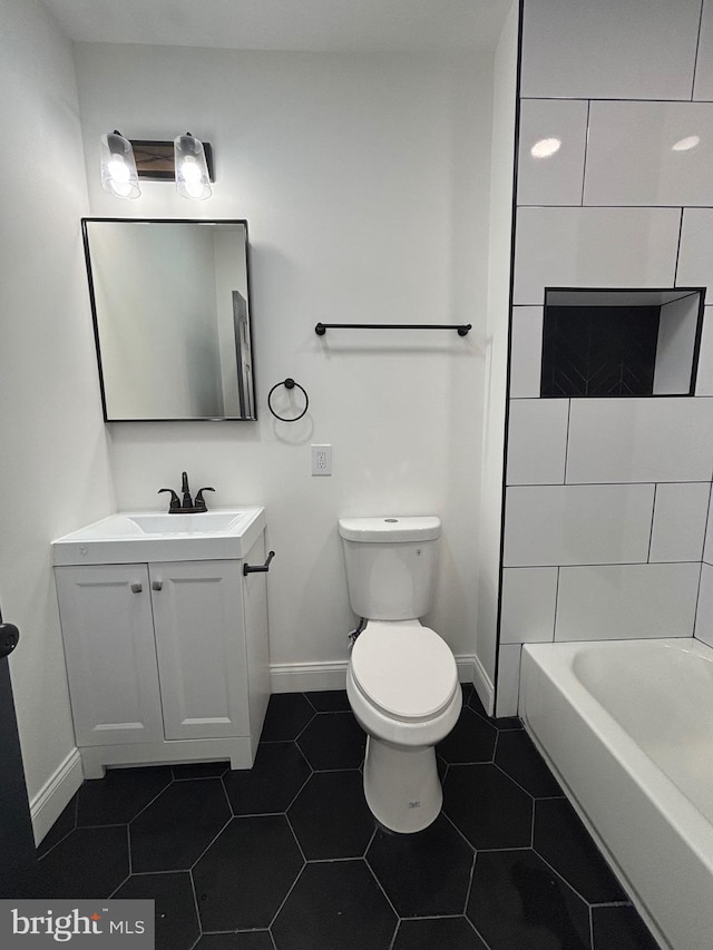 1748 N Chester St, Baltimore, MD 21213 - bathroom with vanity, baseboards, toilet, and tile patterned flooring