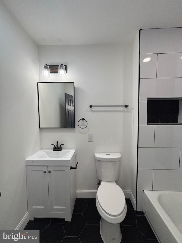 1748 N Chester St, Baltimore, MD 21213 - full bath with baseboards, vanity, toilet, and tile patterned floors