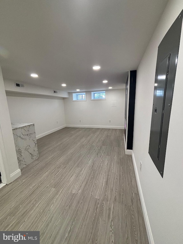 1748 N Chester St, Baltimore, MD 21213 - basement featuring recessed lighting, wood finished floors, and baseboards