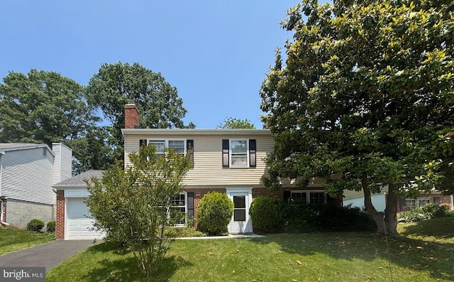 6819 Ben Franklin Rd, Springfield, VA 22150 - colonial home featuring brick siding, a front yard, a chimney, a garage, and driveway