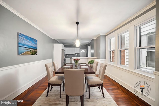 267 S 63rd St, Philadelphia, PA 19139 - dining room with ornamental molding, dark wood finished floors, baseboards, and wainscoting