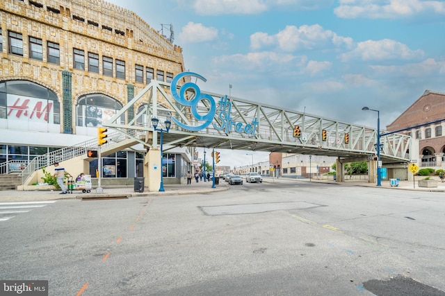 267 S 63rd St, Philadelphia, PA 19139 - view of asphalt street with street lights, sidewalks, curbs, stairs, and traffic lights