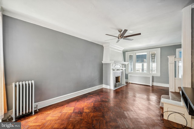 267 S 63rd St, Philadelphia, PA 19139 - unfurnished living room with radiator heating unit, radiator, ceiling fan, ornamental molding, and a large fireplace
