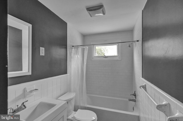 1401 Rockland St, Reading, PA 19604 - bathroom featuring tile walls, shower / tub combo, toilet, vanity, and wainscoting