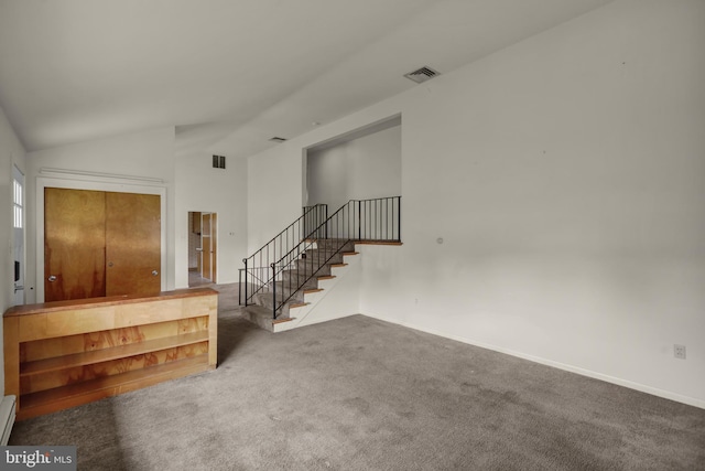 1401 Rockland St, Reading, PA 19604 - entryway with carpet floors, stairway, vaulted ceiling, baseboards, and a baseboard radiator