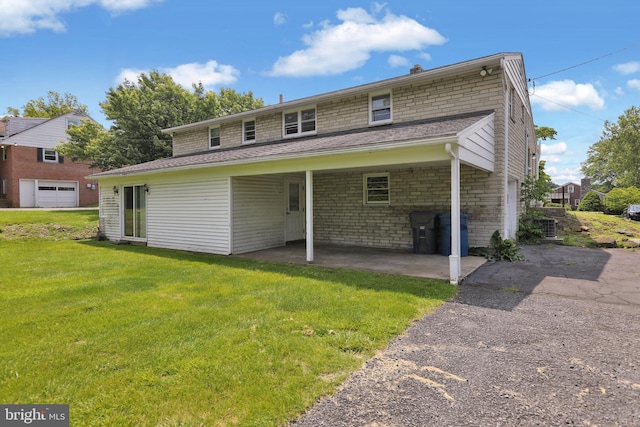 1401 Rockland St, Reading, PA 19604 - back of house featuring a lawn, a patio area, and driveway