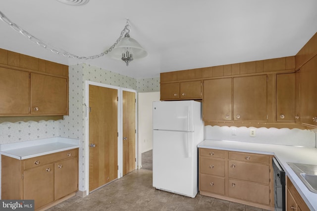 1401 Rockland St, Reading, PA 19604 - kitchen with freestanding refrigerator, wallpapered walls, light countertops, dishwasher, and brown cabinets