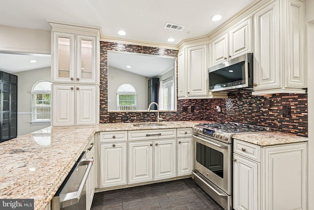 5 Locust Ln, Newtown, PA 18940 - kitchen featuring stainless steel appliances, a sink, healthy amount of natural light, tasteful backsplash, and vaulted ceiling