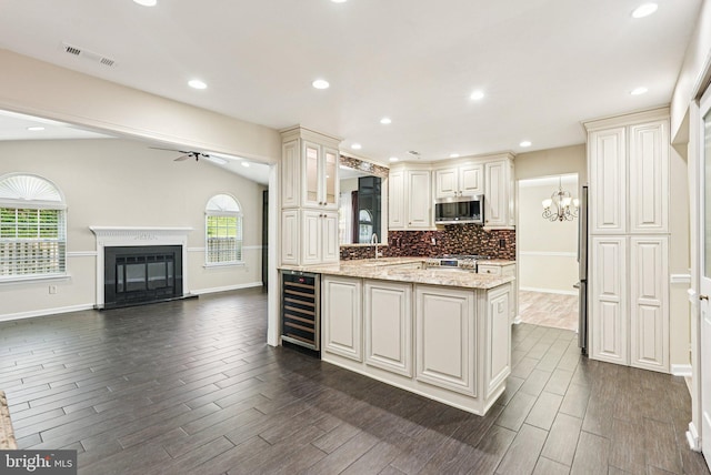 5 Locust Ln, Newtown, PA 18940 - kitchen with stainless steel appliances, ceiling fan, dark wood finished floors, open floor plan, and beverage cooler
