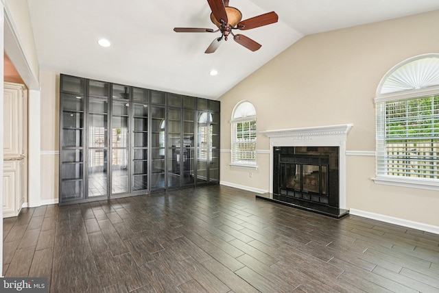 5 Locust Ln, Newtown, PA 18940 - unfurnished living room featuring ceiling fan, vaulted ceiling, wood finished floors, plenty of natural light, and a glass covered fireplace