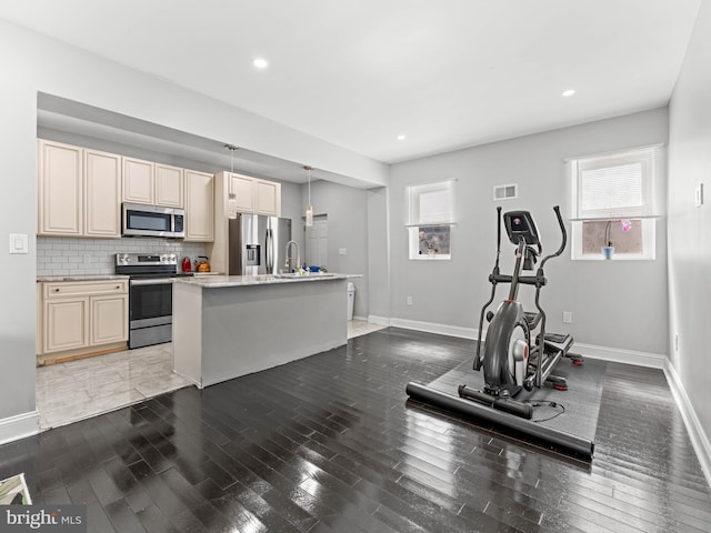 285 N Lansdowne Ave, Lansdowne, PA 19050 - workout room featuring wood finished floors, baseboards, a sink, and recessed lighting