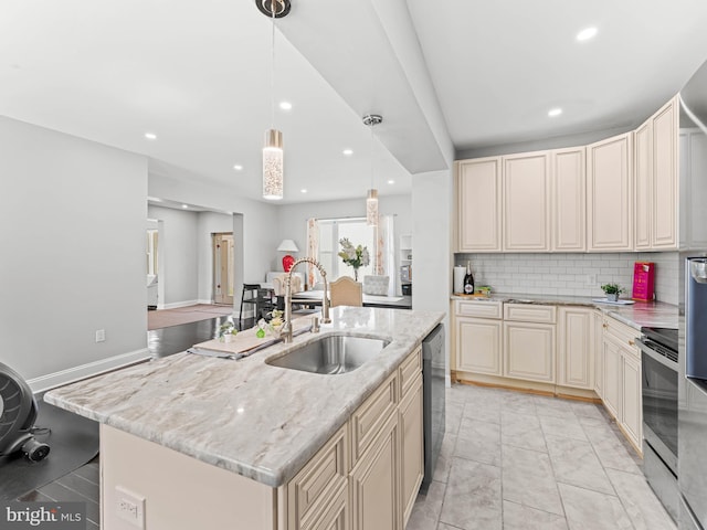 285 N Lansdowne Ave, Lansdowne, PA 19050 - kitchen with a sink, cream cabinetry, recessed lighting, light stone countertops, and dishwasher