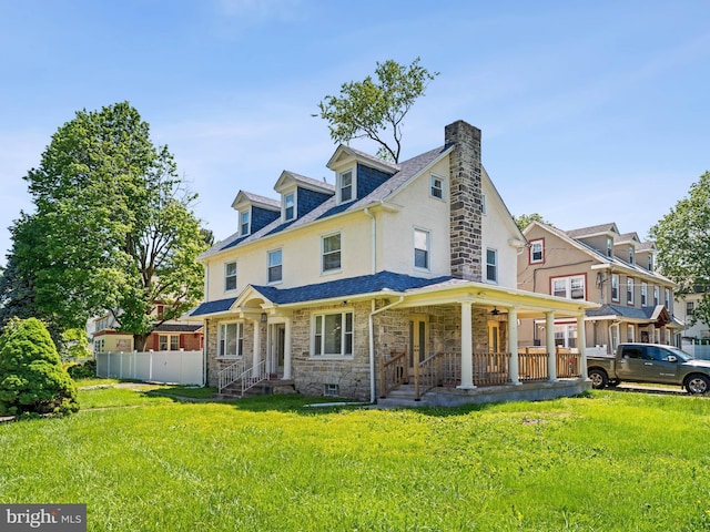285 N Lansdowne Ave, Lansdowne, PA 19050 - back of property featuring a chimney, stone siding, a porch, stucco siding, and a ceiling fan