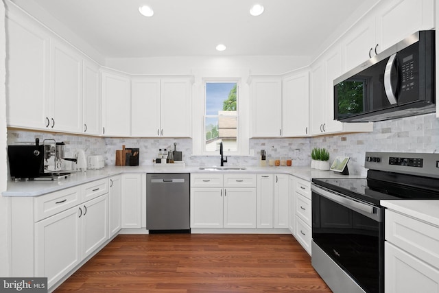 12 Layton Ave S, Camden Wyoming, DE 19934 - kitchen featuring stainless steel appliances, a sink, decorative backsplash, white cabinetry, and recessed lighting