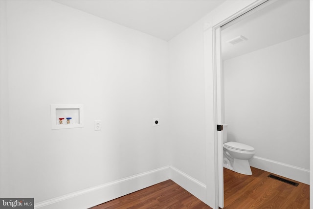 12 Layton Ave S, Camden Wyoming, DE 19934 - laundry area featuring hookup for an electric dryer, washer hookup, dark wood-style flooring, and baseboards