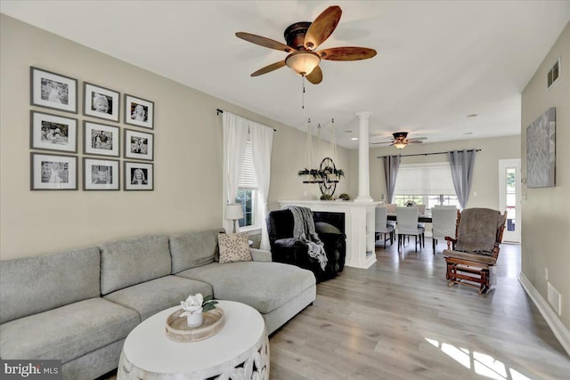 35 Krall Rd, Myerstown, PA 17067 - living area featuring ceiling fan, light wood-style floors, and decorative columns