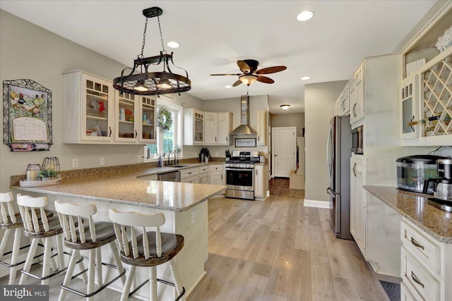 35 Krall Rd, Myerstown, PA 17067 - kitchen with appliances with stainless steel finishes, wall chimney exhaust hood, a peninsula, a ceiling fan, and a sink