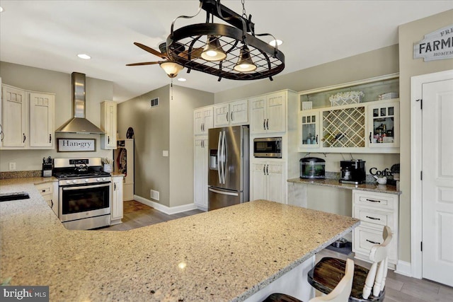 35 Krall Rd, Myerstown, PA 17067 - kitchen featuring appliances with stainless steel finishes, wall chimney exhaust hood, ceiling fan, light stone counters, and recessed lighting