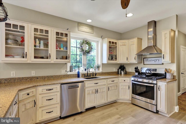 35 Krall Rd, Myerstown, PA 17067 - kitchen featuring appliances with stainless steel finishes, wall chimney exhaust hood, a sink, light wood finished floors, and recessed lighting