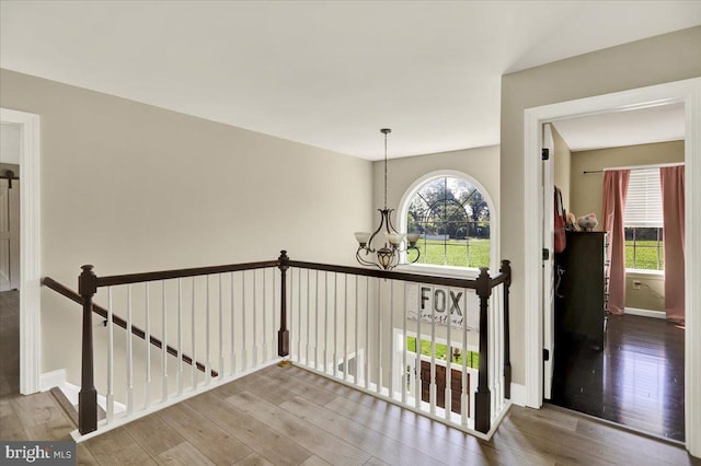 35 Krall Rd, Myerstown, PA 17067 - hallway with an upstairs landing, a chandelier, wood finished floors, and baseboards
