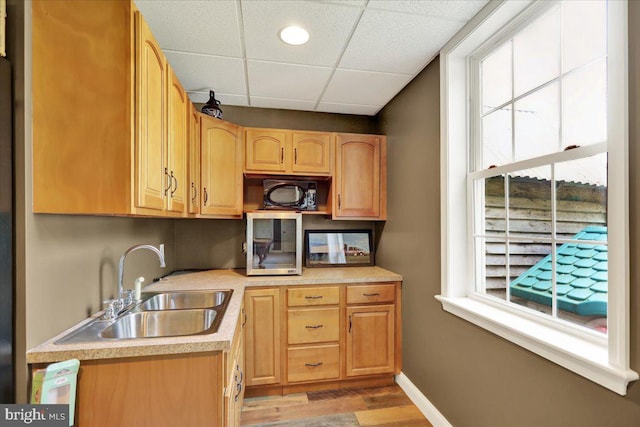 35 Krall Rd, Myerstown, PA 17067 - kitchen featuring a sink, a paneled ceiling, light wood finished floors, light countertops, and baseboards