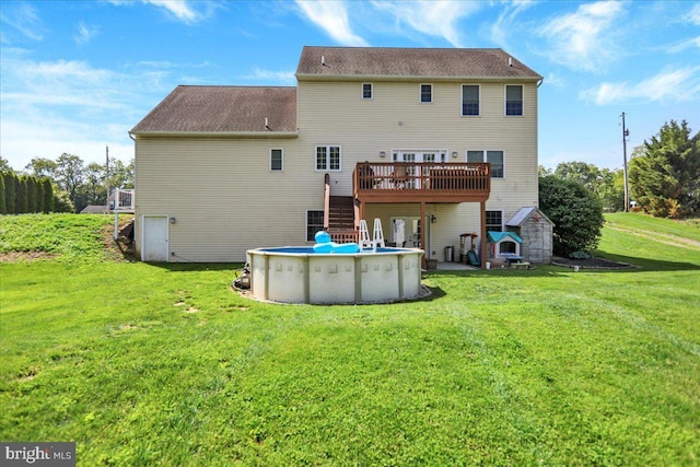 35 Krall Rd, Myerstown, PA 17067 - rear view of property with stairs, a wooden deck, a lawn, and an outdoor pool