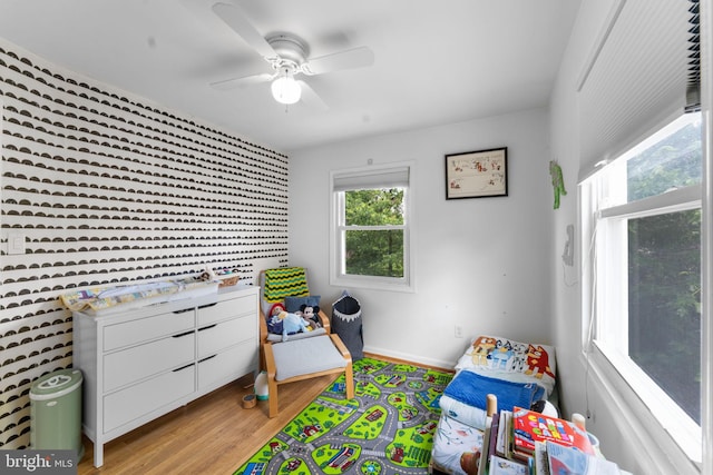 6807 Radcliffe Dr, Alexandria, VA 22307 - playroom with light wood finished floors, a ceiling fan, and baseboards