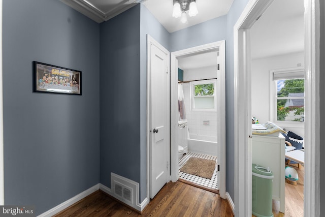 6807 Radcliffe Dr, Alexandria, VA 22307 - corridor featuring dark wood-style floors, healthy amount of natural light, and baseboards