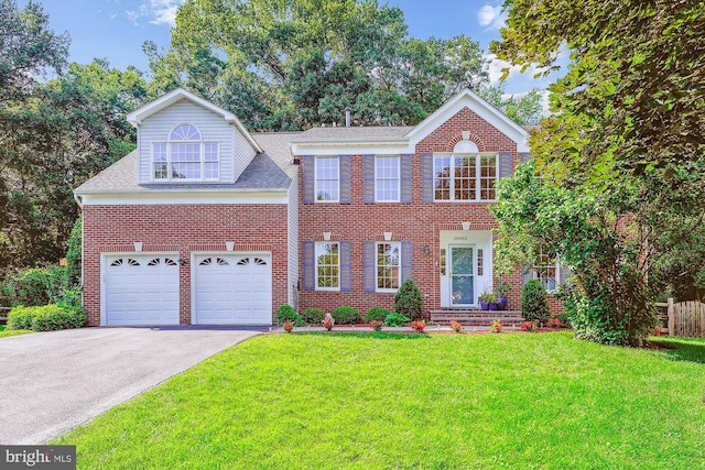 19802 Shady Brook Way, Gaithersburg, MD 20879 - view of front of home with driveway, brick siding, a front yard, and a garage