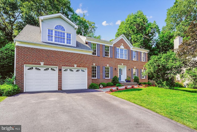 19802 Shady Brook Way, Gaithersburg, MD 20879 - view of front of property featuring driveway, brick siding, a front yard, and a garage
