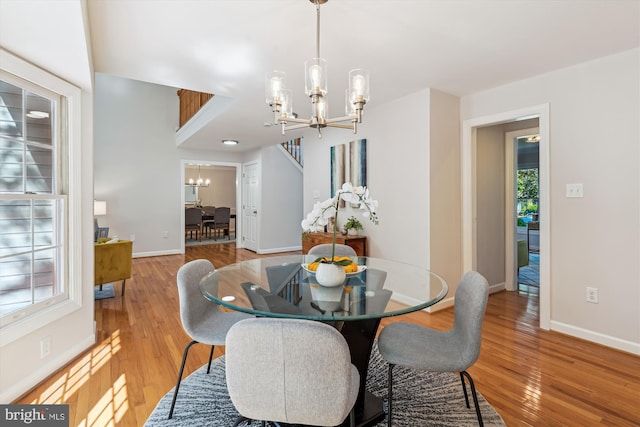 19802 Shady Brook Way, Gaithersburg, MD 20879 - dining area featuring a chandelier and wood finished floors