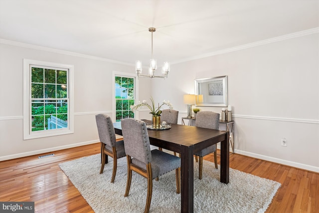 19802 Shady Brook Way, Gaithersburg, MD 20879 - dining area with crown molding, a chandelier, and light wood-style flooring
