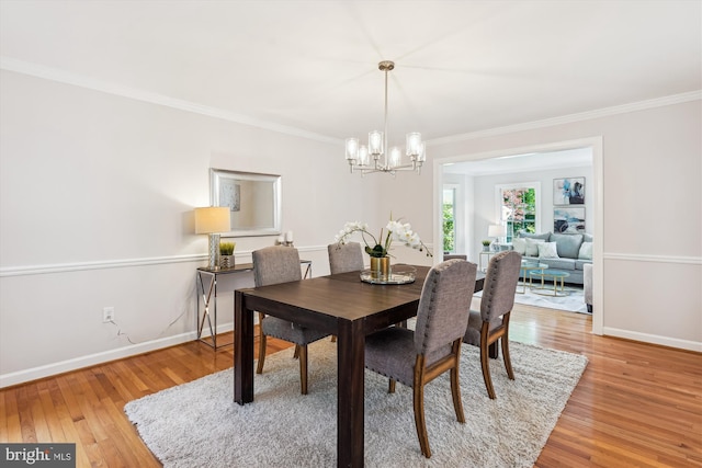 19802 Shady Brook Way, Gaithersburg, MD 20879 - dining room with ornamental molding, a chandelier, and light wood-style flooring