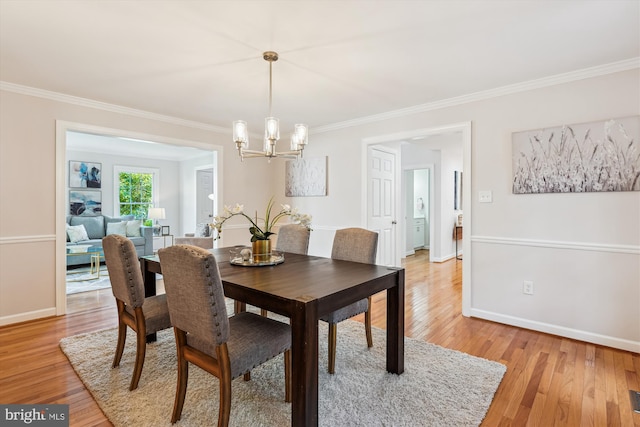 19802 Shady Brook Way, Gaithersburg, MD 20879 - dining room with crown molding, a chandelier, and light wood-style floors