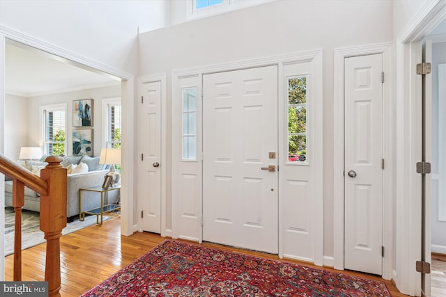 19802 Shady Brook Way, Gaithersburg, MD 20879 - foyer entrance featuring light wood-type flooring and crown molding